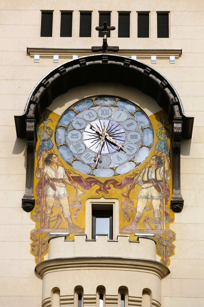 The clock faces on the Palace of Culture clock tower are decorated with stained glass representing the 12 astrological signs.