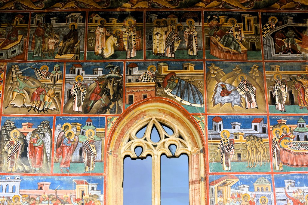 A view of the colourful frecoes which adorn the exterior walls of the chuch at Voronet Monastery, a UNESCO World Heritage Site.