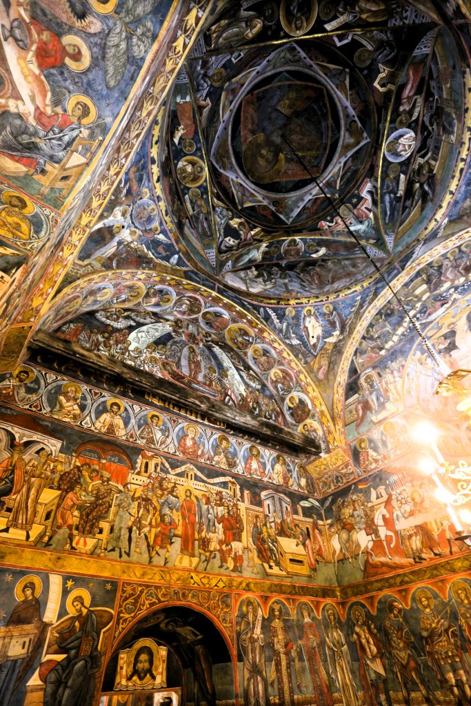 A view of the frescoe-covered church interior at Humorului Monastery.