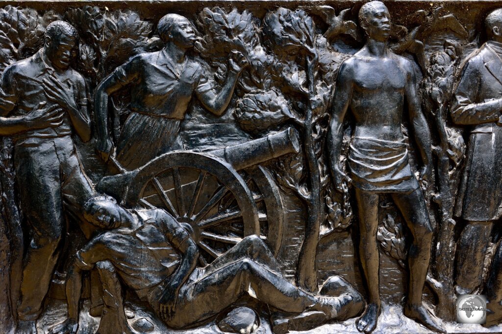 Bronze relief plates at the Joseph J. Roberts Monument depict the life of Liberia's first president.