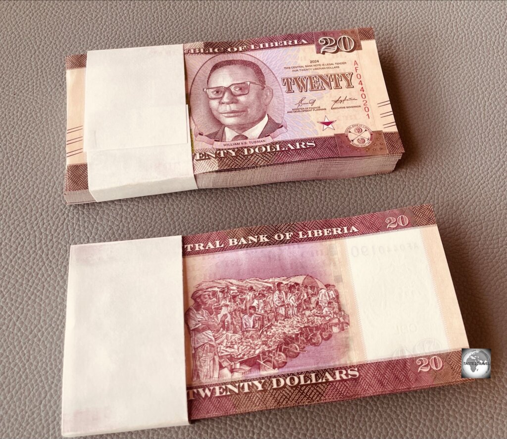 I purchased these two wads of uncirculated LRD $20 banknotes (worth USD$20 in total) from a currency trader on Ashmun street, the main street of Monrovia.