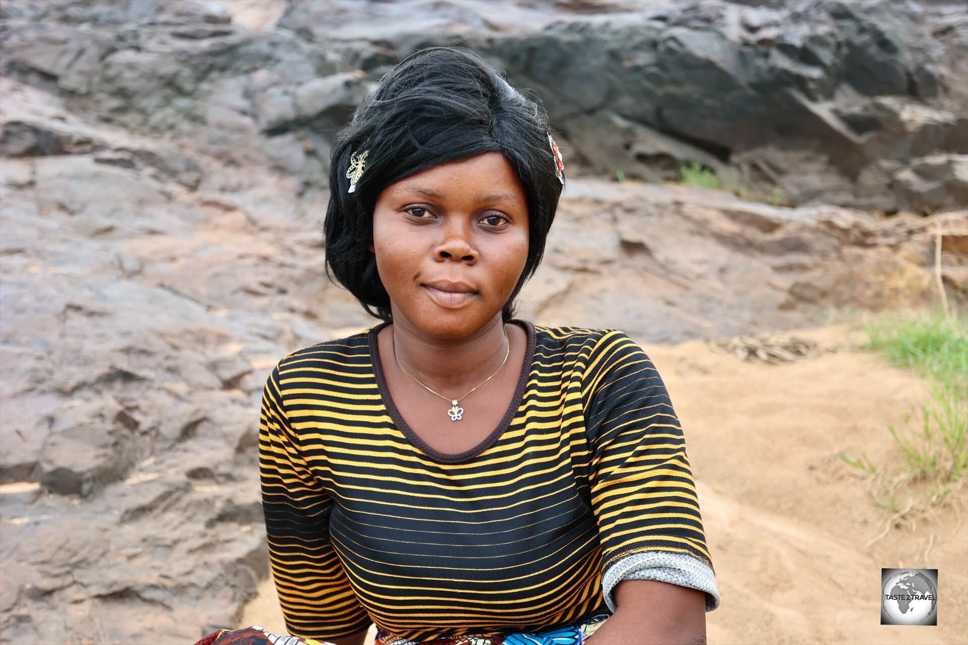A young woman, waiting on the banks of the Ubangi River, which flows past Bangui.
