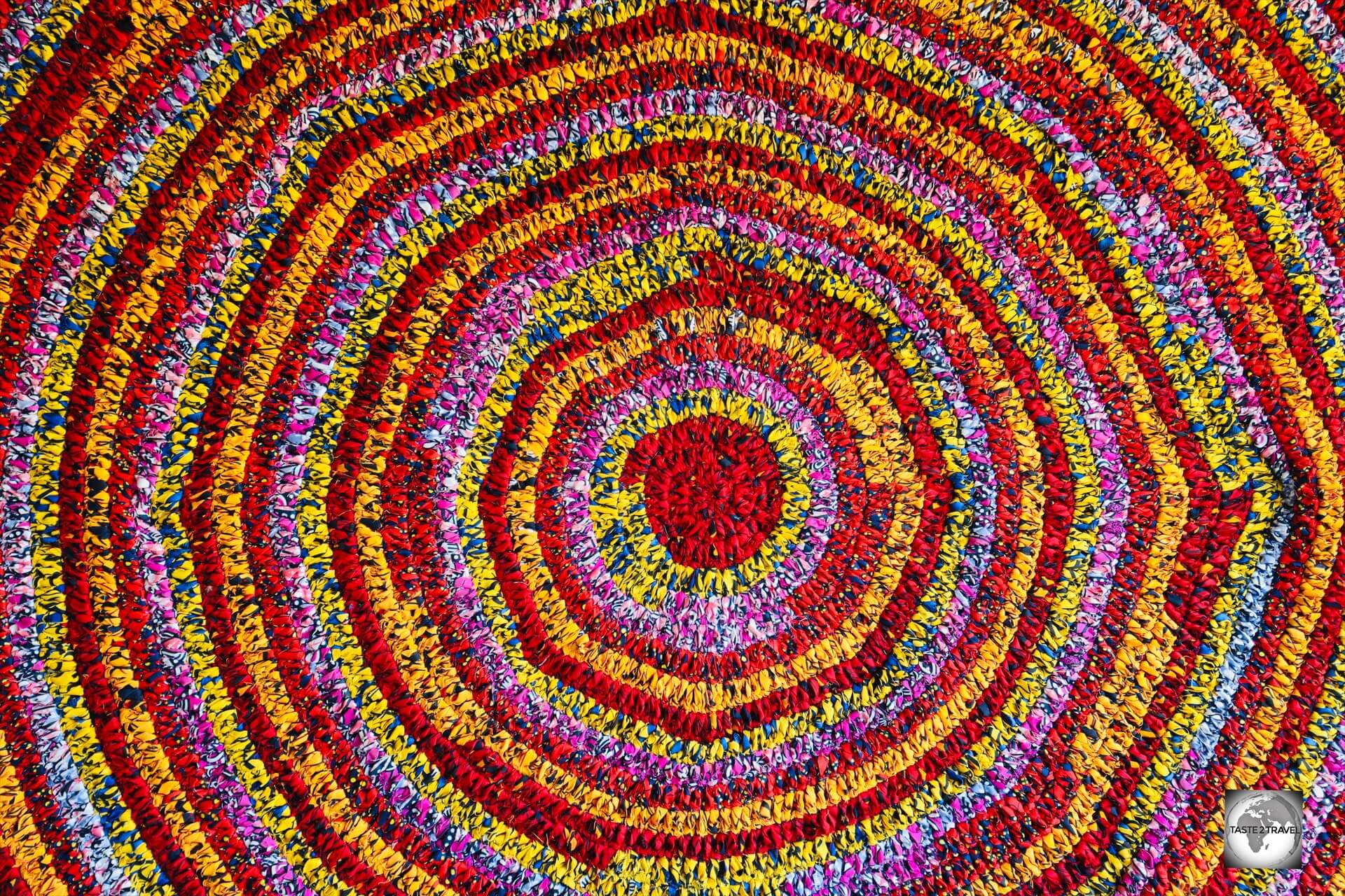 A stunning rug, braided using local fabric, which was made by the talented artisans at Ndara.