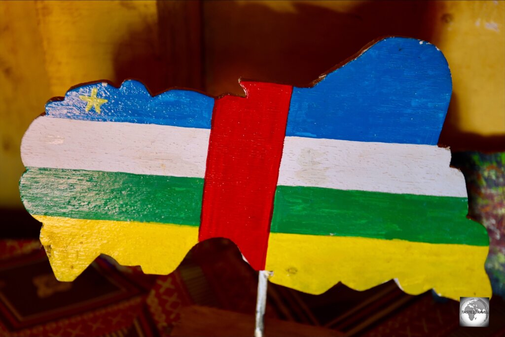 A wooden map of the Central African Republic, painted with the colours of the national flag.