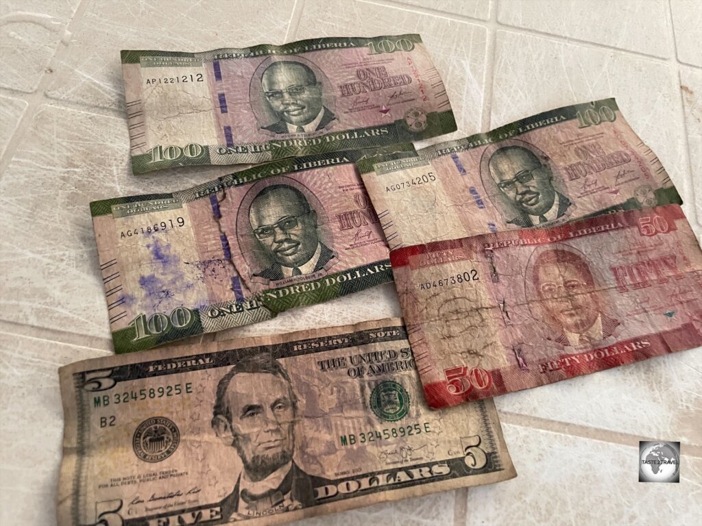 Change in Liberia, such as these notes which I received in a cafe, is often given as a mixture of US and Liberian dollars, with notes normally being in terrible condition.