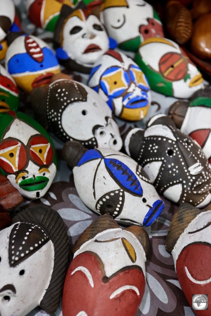 Traditional pottery masks for sale at a craft market in Brazzaville.