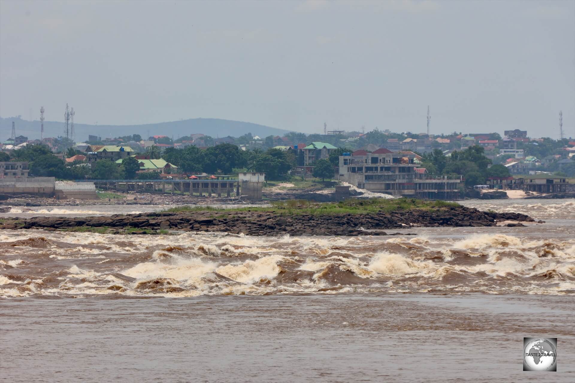 The Congo River separates Brazzaville, the capital of the Republic of the Congo, from Kinshasa, the capital of the DRC, which can be seen in the distance.