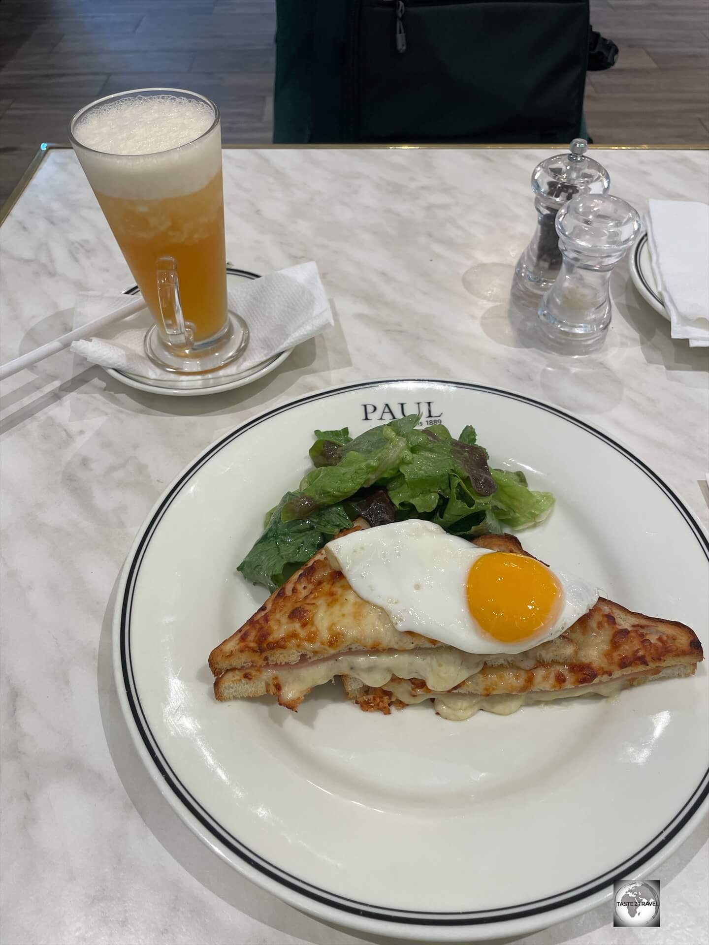 Lunch at Paul in Brazzaville, featuring a French classic - Croque Madame - with a freshly made ice tea.