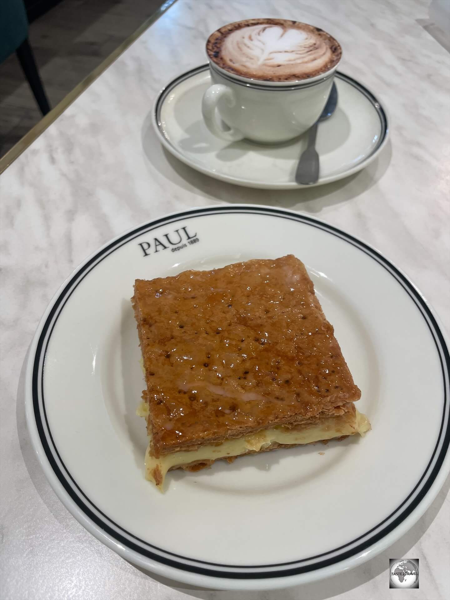 A cappuccino and a freshly made mille-feuille, the perfect afternoon tea at Paul in Brazzaville.