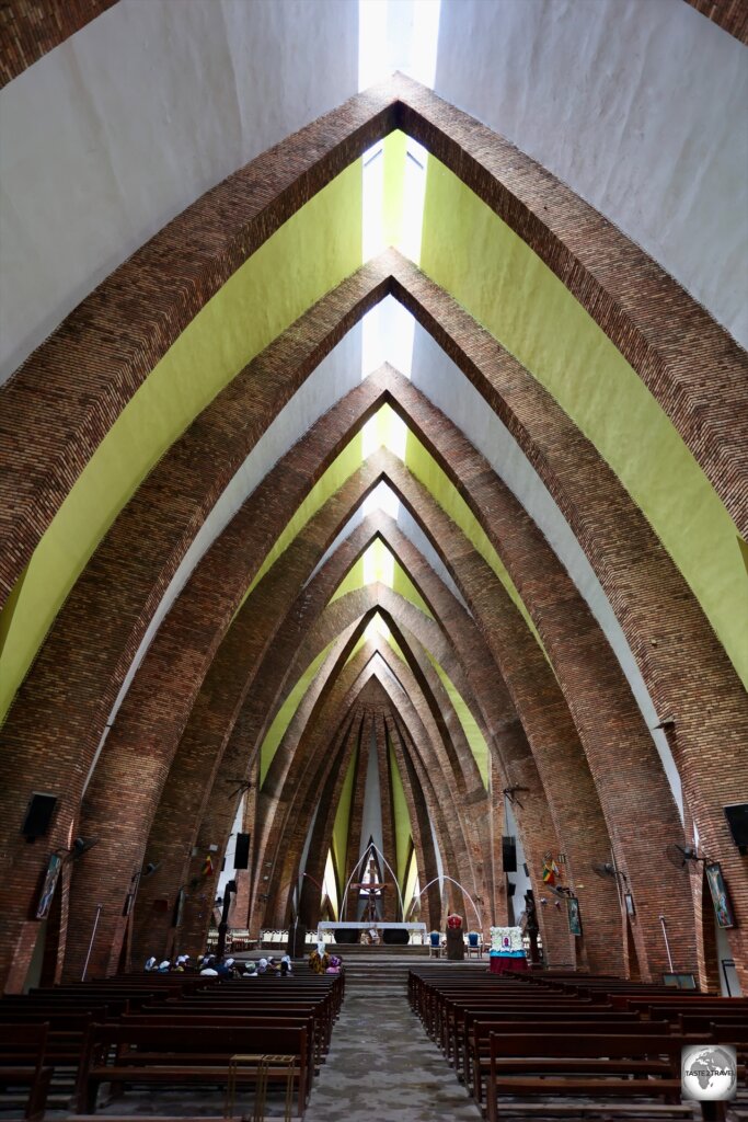 The interior of the basilica features features soaring, pointy arches which were inspired by Congolese spears.