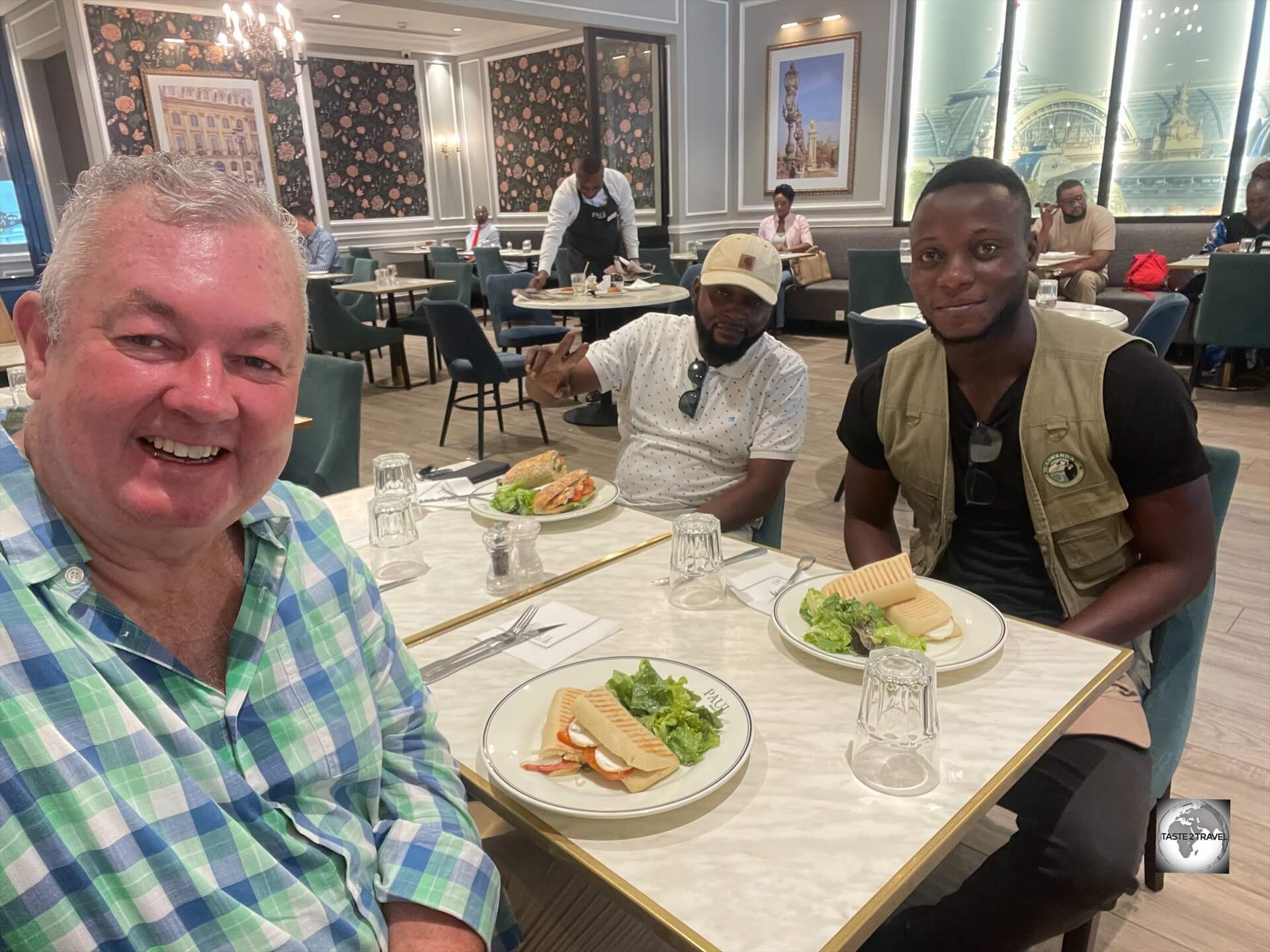 After a hot and sweaty city tour, I treated my guide Satch (pictured right) and driver to lunch at Paul in Brazzaville.
