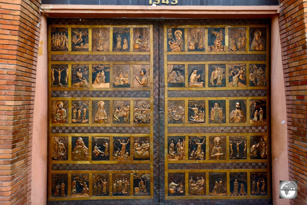 The entrance to Sainte-Anne of the Congo Basilica is through these striking copper doors, which were designed by sculptor Albert Gilles.