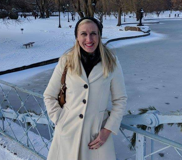 Louise Slyth posing by a frozen lake