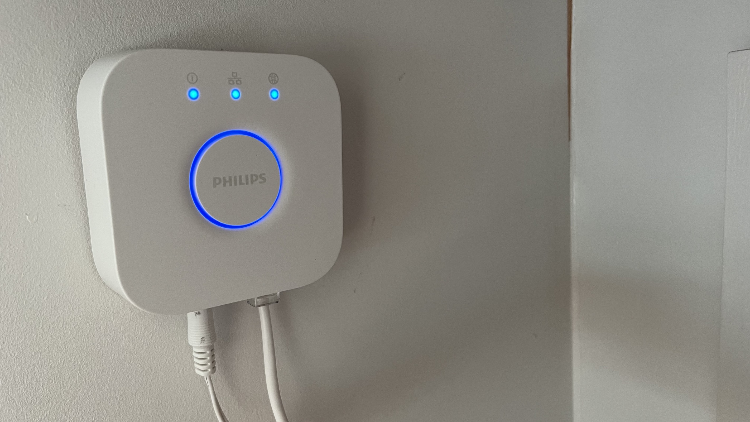 philips hue bridge mounted on wall