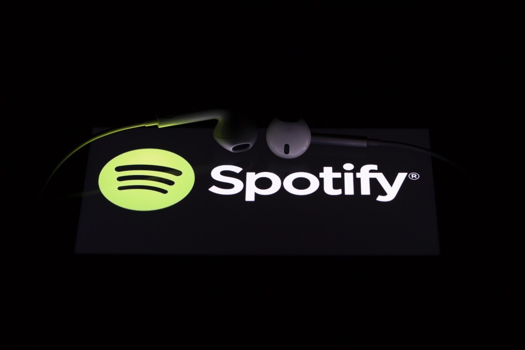 Spotify logo with Airpods