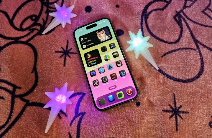 iPhone 14 Pro with custom home screen icons and widgets
