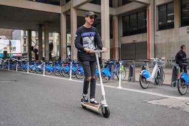 riding Unagi Model One Voyager electric scooter 