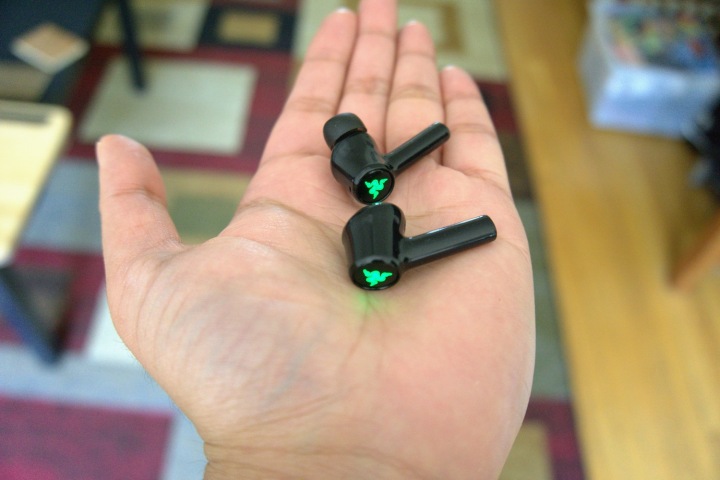 Razer Hammerhead held in palm.