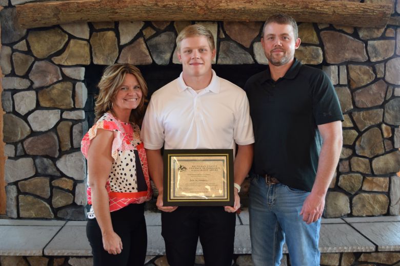 Ian Scammell, center, was the winner of a $1,500 Buchanan County Chamber of Commerce Scholarship. He is pictured here with his parents, Chris, right and Chairty Scammell, left.
