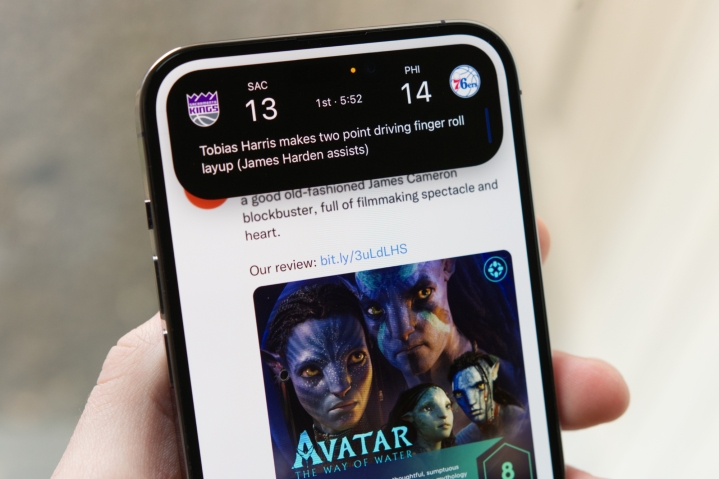 Sports scores for an NBA game displayed in an iPhone 14 Pro's Dynamic Island.
