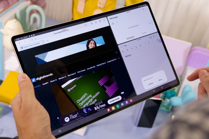 Someone using multiple apps on the Samsung Galaxy Tab S9 Ultra.