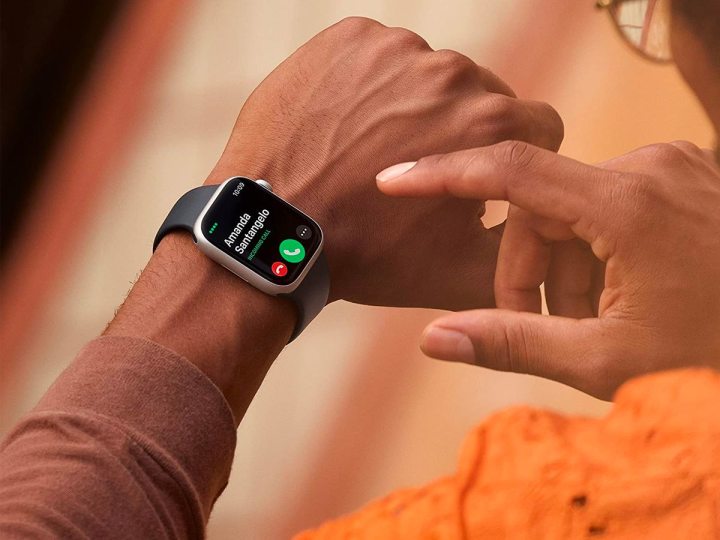 Close-up of a person taking a call on their Apple Watch Series 8.