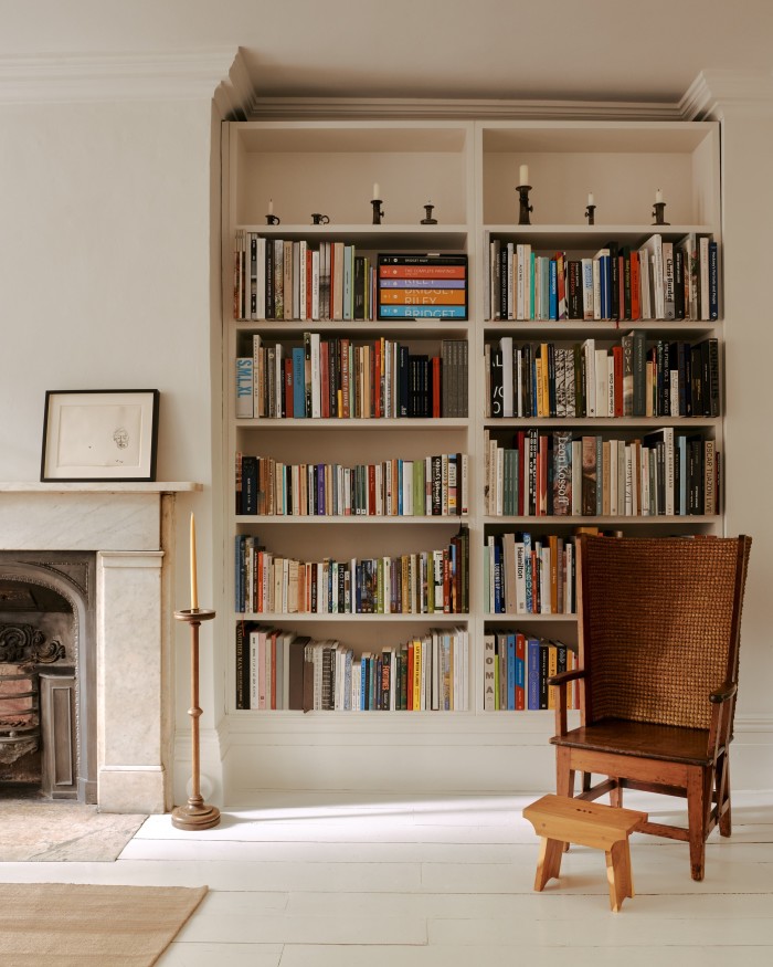 Portrait of Andy Warhol by Alice Neel in the library, with candlesticks by Steve Harrison and chairs from Scotland