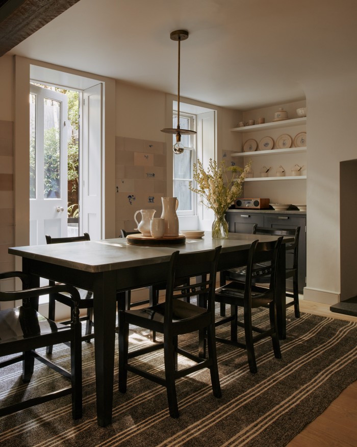 The kitchen, with a c1900 kilim rug on the floor and (on far wall) ceramics from Cape Town