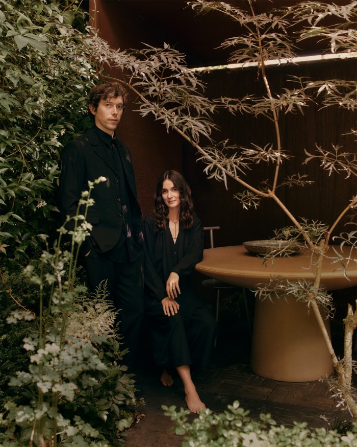 James Brown and his wife Christie Fels in the walled garden of their home in east London