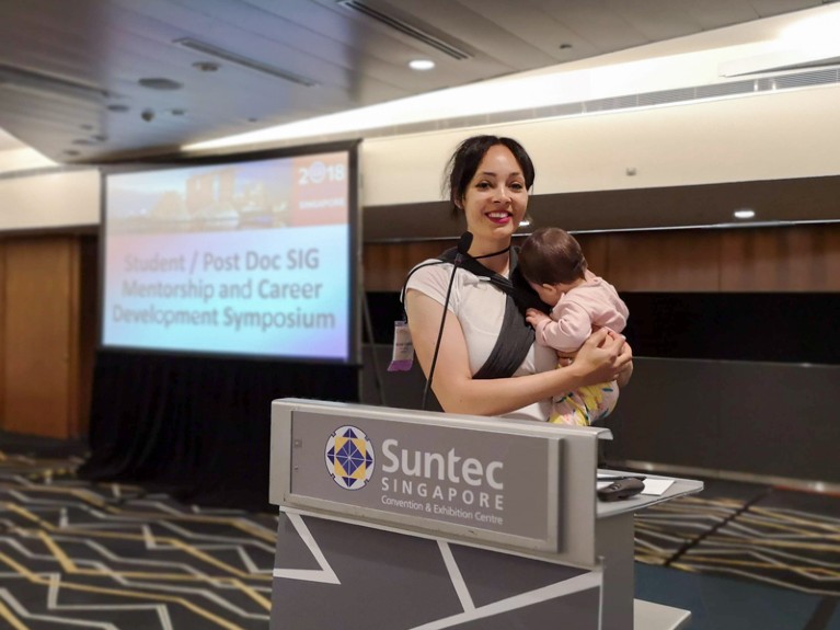 Michele Veldsman with her baby daughter at a conference