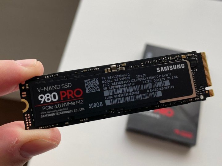 The Samsung 980 Pro SSD being held in someone's hand.