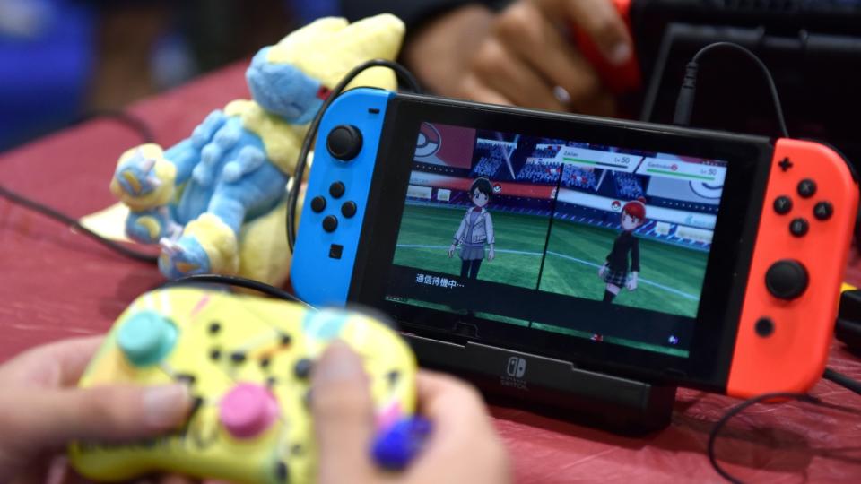 A competitor plays Pokemon on his Nintendo Switch. (Getty Images)