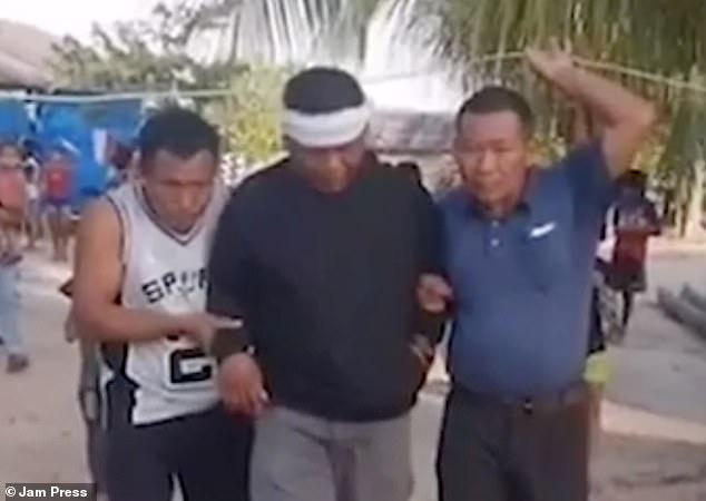 Terrified villagers in rural northern Peru claimed they were under attack by 7ft-tall aliens this summer, which they have dubbed 'los Pelacaras' (the Face Peelers). Above, a man with bandages around his head, who was supposedly attacked by the aliens