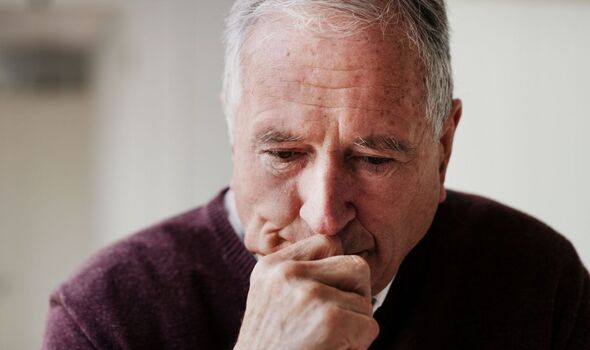 An elderly man looking worried