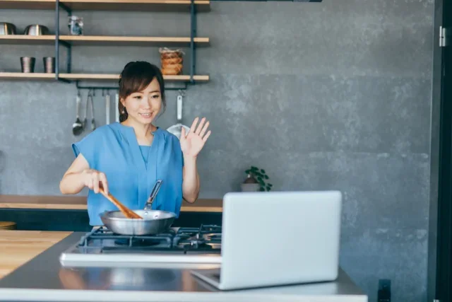 Women cooking and filming herself