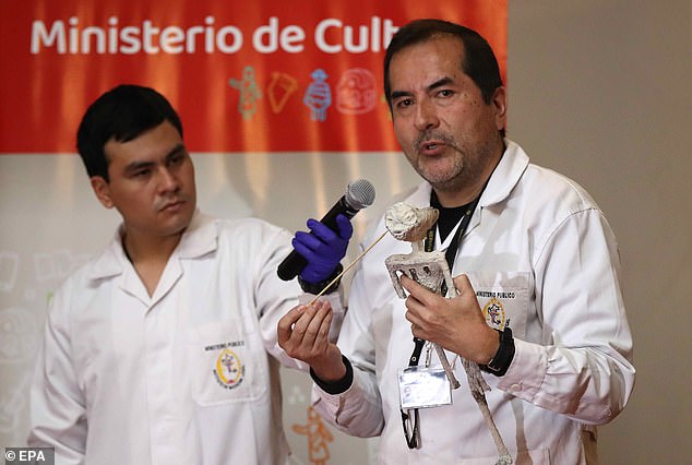 Flavio Estrada (right), forensic archaeologist of the Institute of Legal Medicine and Forensic Sciences of Lima of the Public Ministry