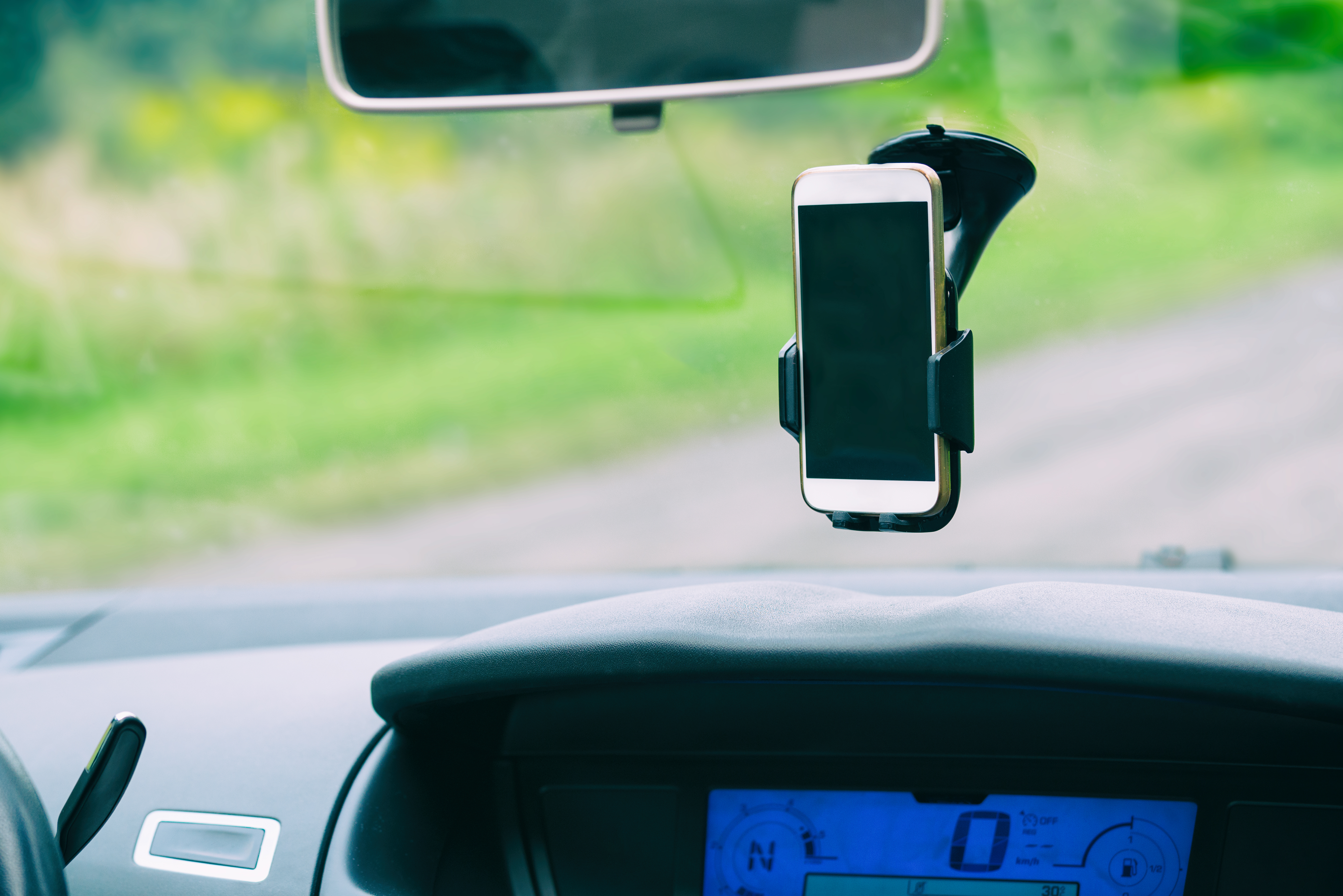 Many drivers use phone holders or dashboard cameras attached to their windscreen