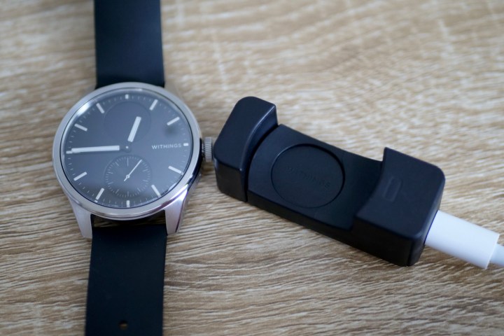 The Withings ScanWatch 2 with its charger.