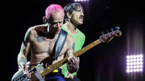 Bassist Flea and singer Anthony Kiedis of Red Hot Chili Peppers perform