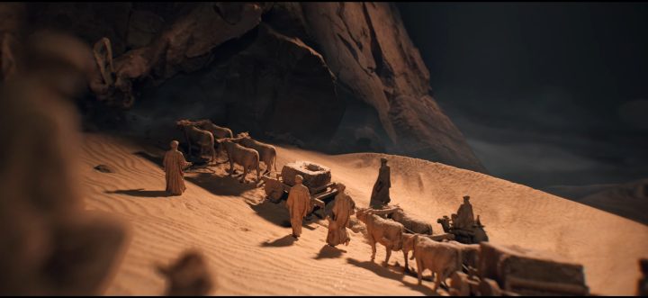 Figures walking through the dessert in Civilization 7.