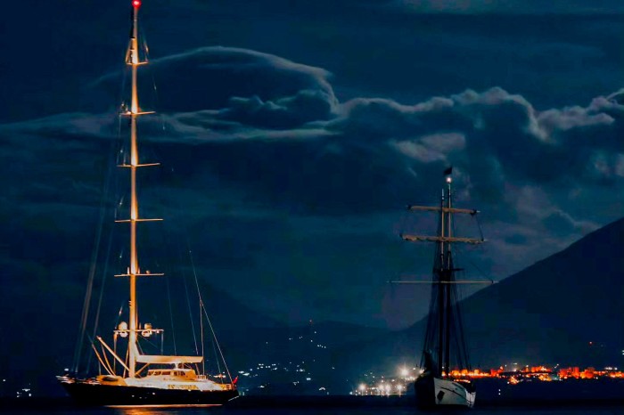 Bayesian, left, pictured at anchor off the village of Porticello on Sunday evening