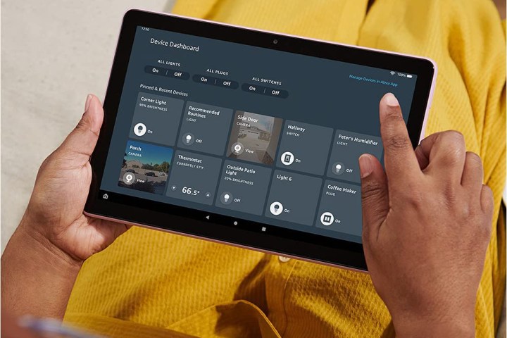 Amazon Fire HD 10 in hand.