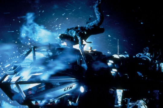 A screenshot from the movie Armageddon showing a crash on an asteroid.