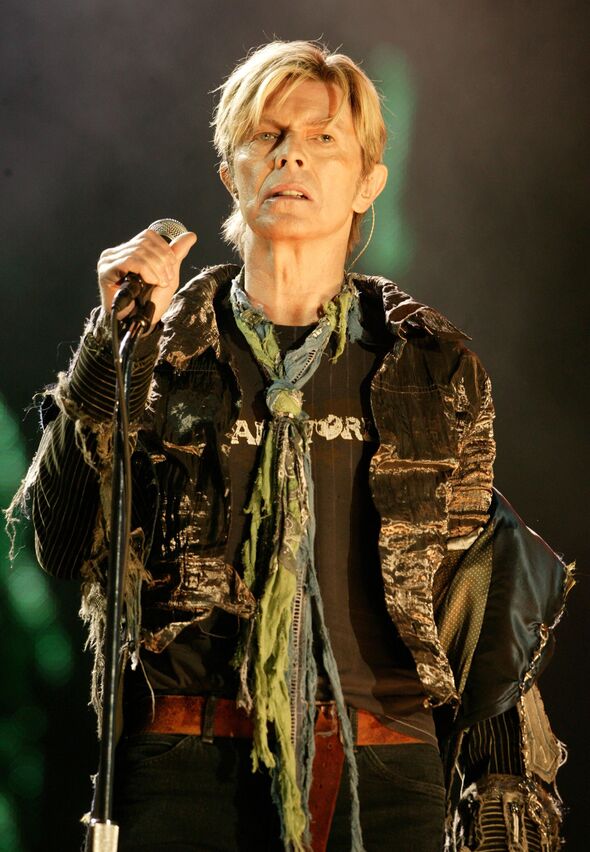 Davids Bowie performing at the Isle of Wight Festival in 2004