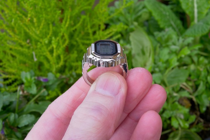 A person holding the Casio Ring Watch, showing the buttons.