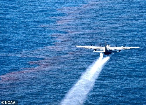 In some cases, oil-dispersing chemicals will be dropped from planes or helicopters to help the oil naturally disperse. These act like washing detergents to break the oil down into smaller droplets. Pictured: A U.S. Air Force plane drops an oil-dispersing chemical onto an oil slick on the Gulf of Mexico in 2010