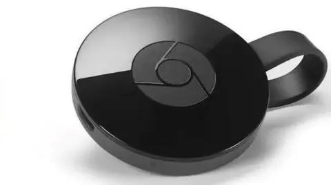 Google A black shiny circular Chromecast dongle for TVs