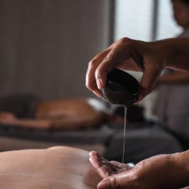 close-up-masseur-pouring-aroma-oil-hand-less-scaled-slider close-up-masseur-pouring-aroma-oil-hand-less-scaled-slider
