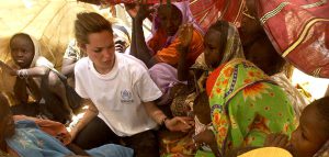 UNHCR Goodwill Ambassador Angelina Jolie sits and speaks with Sudanese women who have just crossed the border into Tine, Chad, Friday, June 4, 2004, after fleeing fighting in the Darfur region of Sudan. (AP Photo/ Edward Parsons/UNHCR)