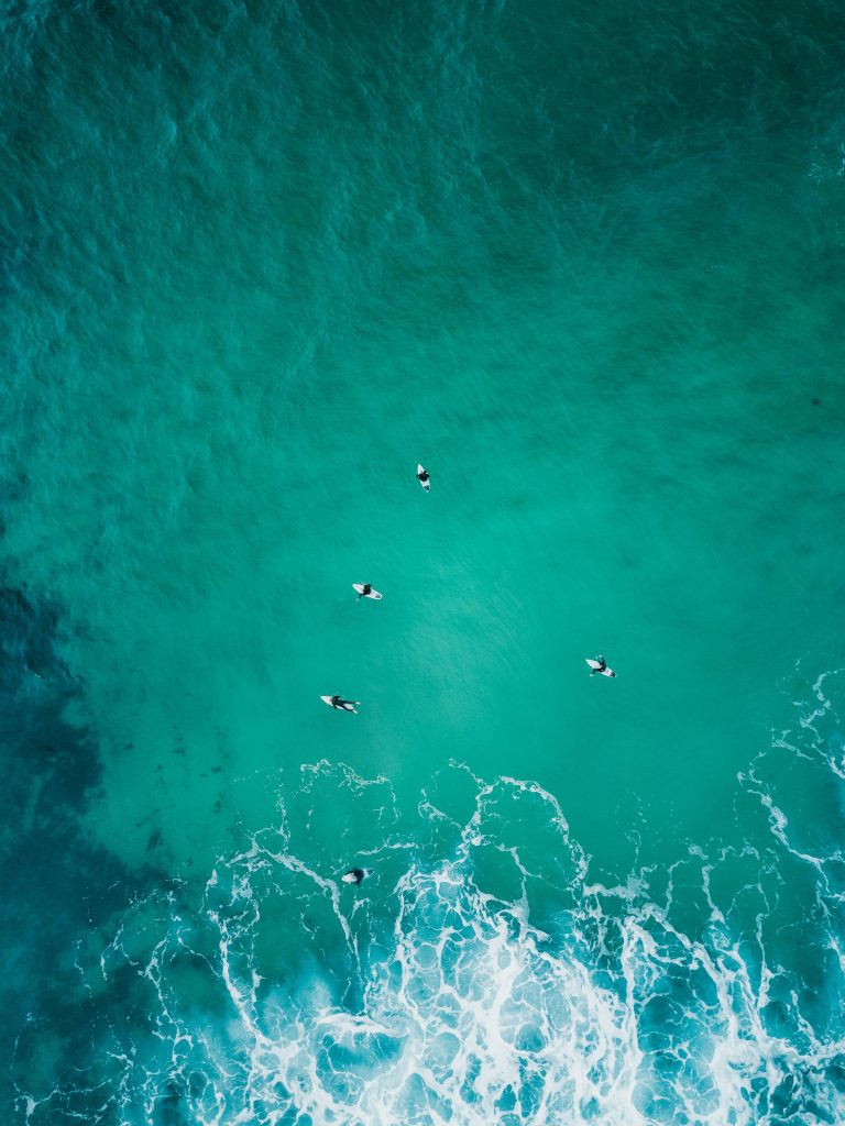 Drone footage of surfers surfing